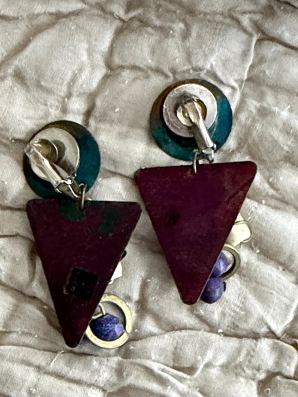 Clip style earrings artist made abstract metal pieces with attached panels
